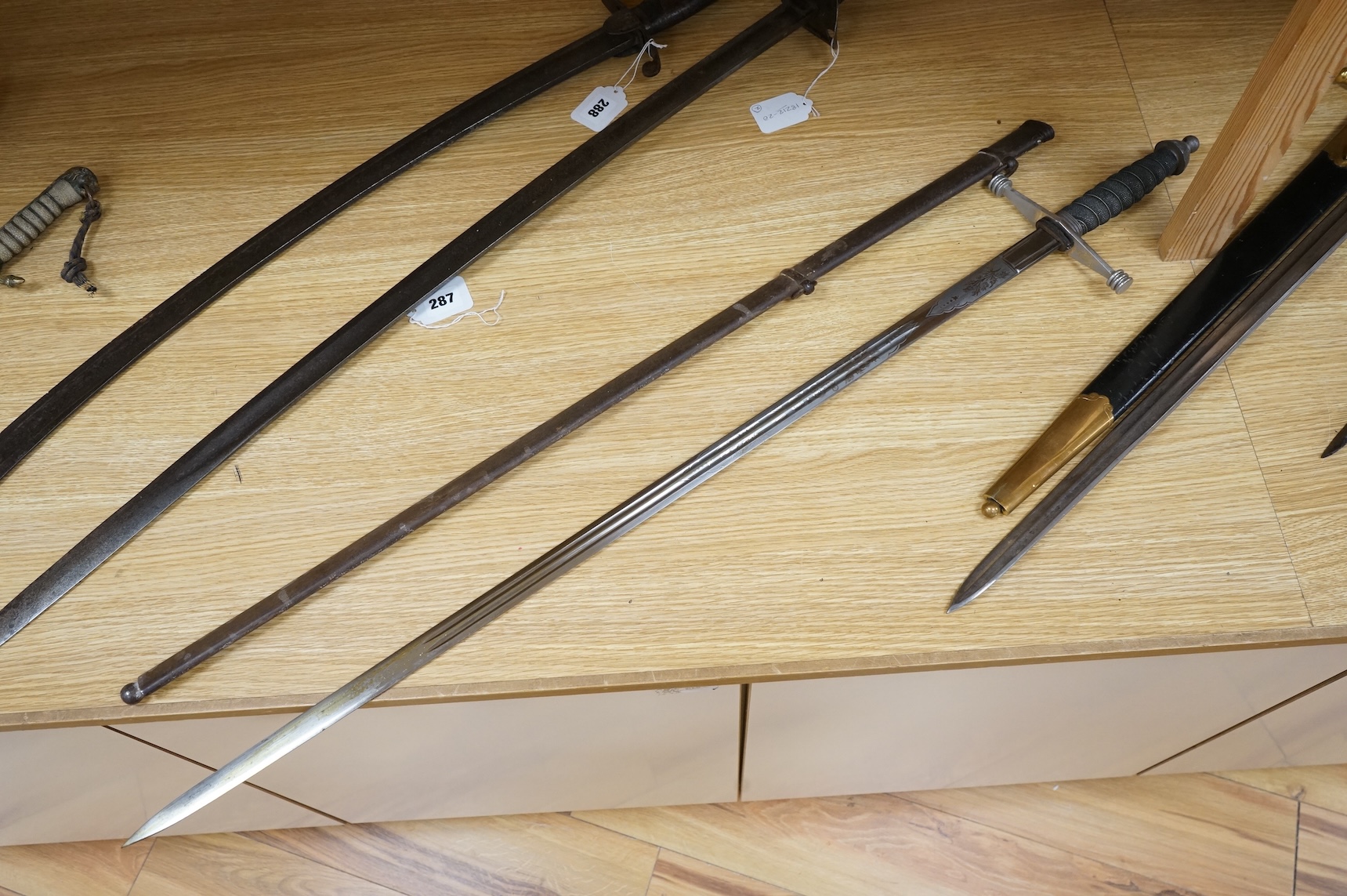 World War I Scottish infantry officer’s undress sword, etched and polished regulation blade with crowned GVR cipher and regulation cruciform hilt, in its steel scabbard